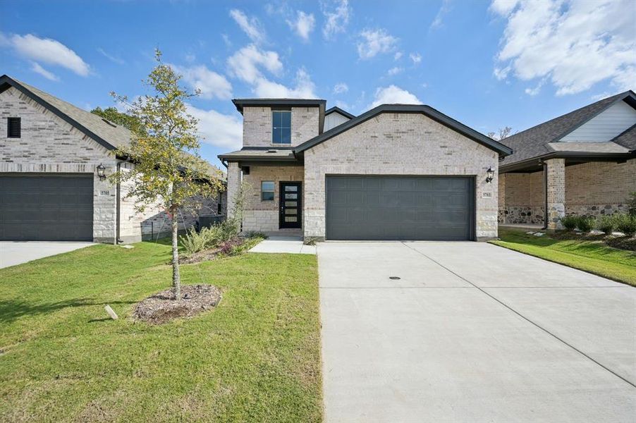 Front exterior of a new home in Eastridge - Spring Series, McKinney, TX, highlighting curb appeal (Image 1). Front exterior of a new home in Eastridge - Spring Series, McKinney, TX, highlighting curb appeal (Image 1).
