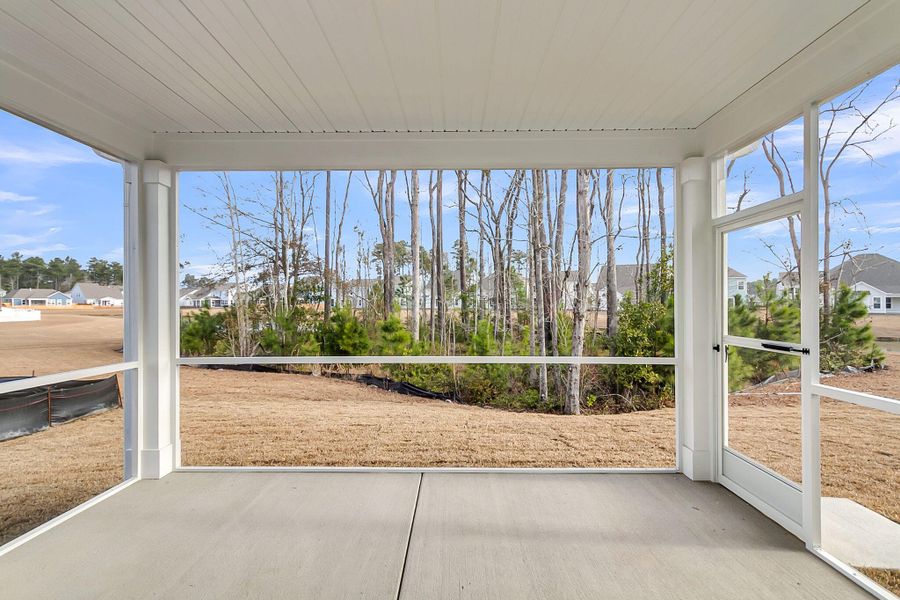 Exterior details and patio area of a home in Tidewater at Lakes of Cane Bay, Summerville (Image 26).