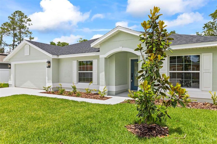 Front exterior of a new home in , Palm Coast, FL, highlighting curb appeal (Image 29).