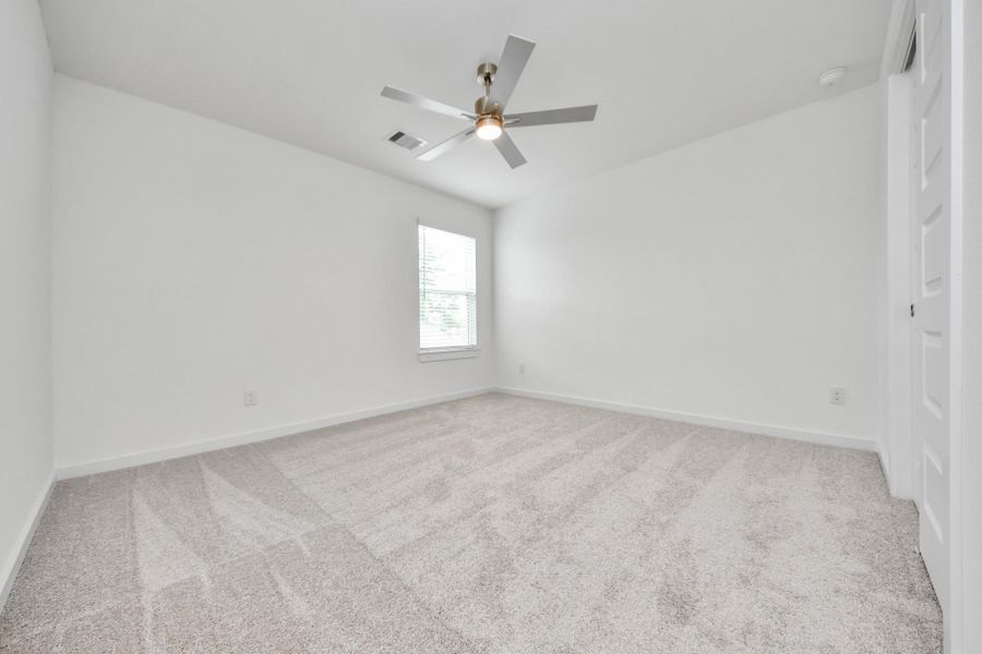 Secondary bedroom features plush carpeting, large windows that let in plenty of natural light, bright paint, and spacious closets. Secondary bedroom features plush carpeting, large windows that let in plenty of natural light, bright paint, and spacious closets.