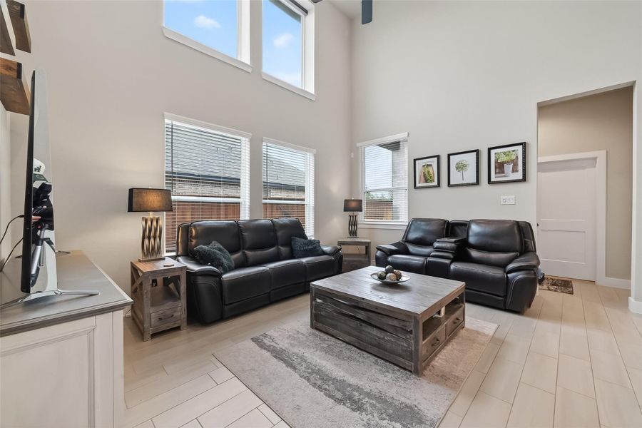 Block some sunlight with the motorized shades installed in the upper windows