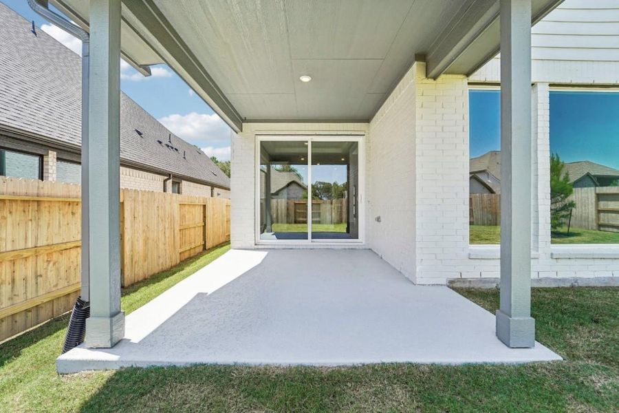 Exterior details and patio area of a home in WILDTREE 50', Montgomery (Image 16). Exterior details and patio area of a home in WILDTREE 50', Montgomery (Image 16).