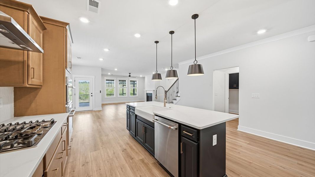 First-rate kitchen with functional layout, designer pendant lighting, and a large center island in Woodruff, SC