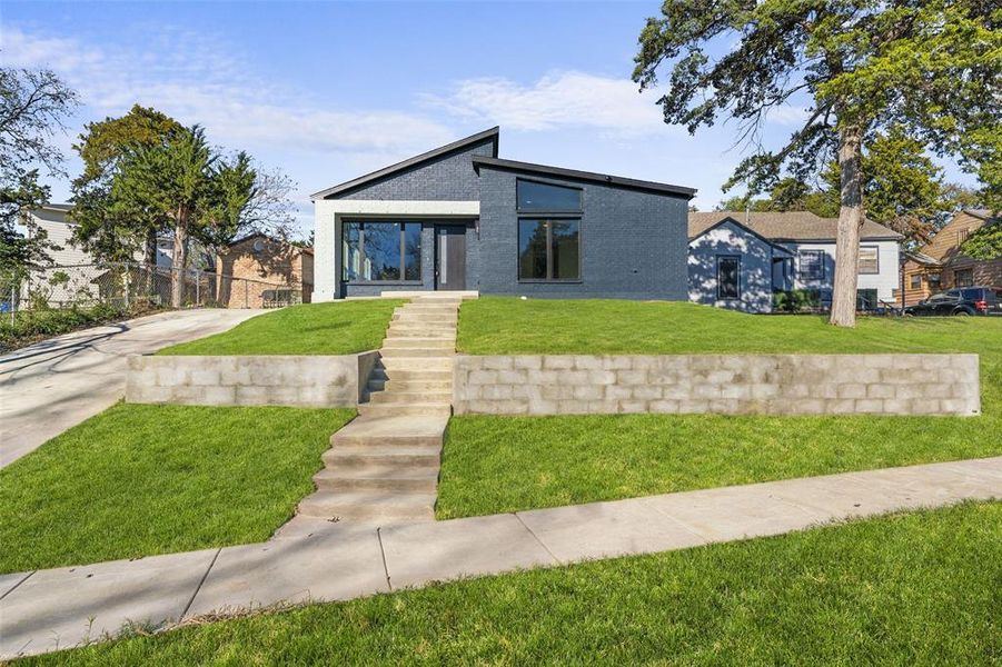 View of front of house with brick siding
