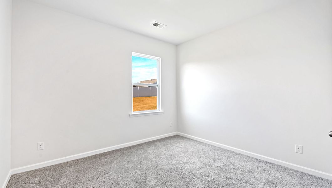 Spacious, unfurnished interior of a new home in Durbin Meadows Traditions, Fountain Inn (Image 23).