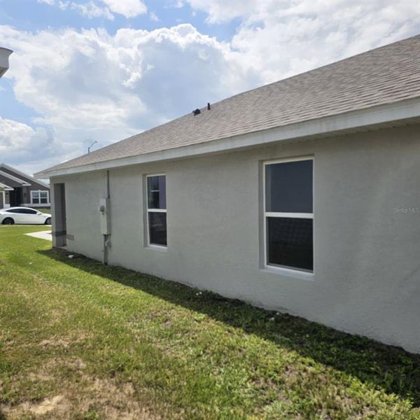 Exterior details and patio area of a home in Magnolia Park, Haines City (Image 22).