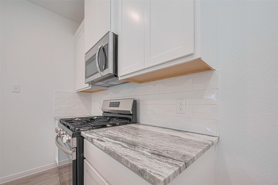 Furnished interior view inside a new home in Sunterra, Katy (Image 6).