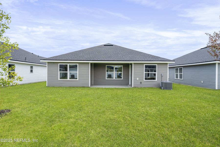 Front exterior of a new home in Summerglen, Jacksonville, FL, highlighting curb appeal (Image 16). Front exterior of a new home in Summerglen, Jacksonville, FL, highlighting curb appeal (Image 16).
