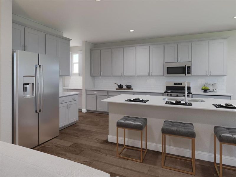 Kitchen featuring stainless steel appliances, a breakfast bar area, backsplash, dark wood-type flooring, and recessed lighting Kitchen featuring stainless steel appliances, a breakfast bar area, backsplash, dark wood-type flooring, and recessed lighting