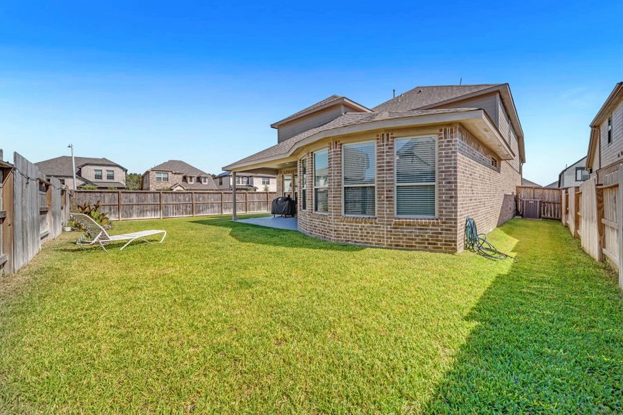 Exterior details and patio area of a home in Mavera, Conroe (Image 2).