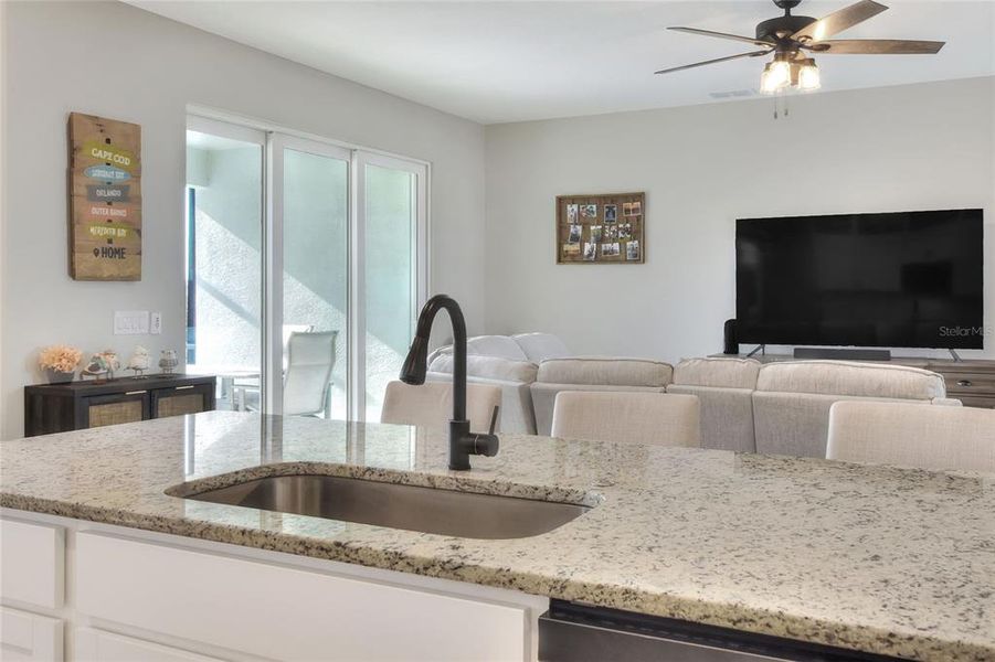 Kitchen overlooks the open layout.