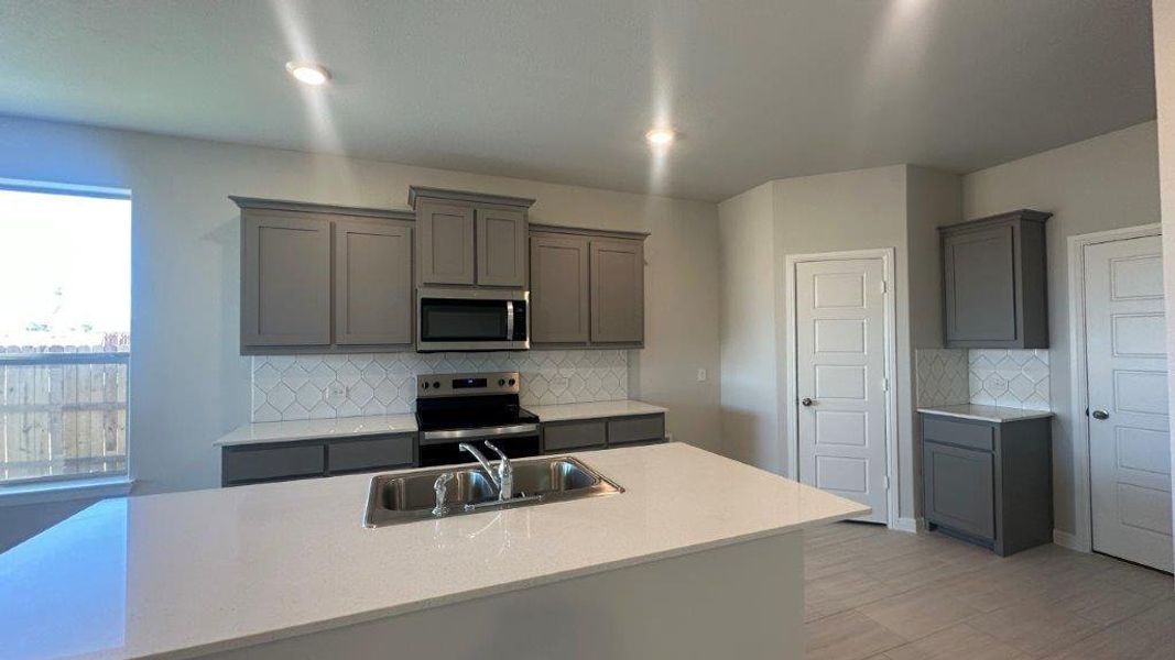 Kitchen - All Home and community information, including pricing, included features, terms, availability and amenities, are subject to change at any time without notice or obligation. All Drawings, pictures, photographs, video, square footages, floor plans, elevations, features, colors and sizes are approximate for illustration purposes only and will vary from the homes as built. Kitchen - All Home and community information, including pricing, included features, terms, availability and amenities, are subject to change at any time without notice or obligation. All Drawings, pictures, photographs, video, square footages, floor plans, elevations, features, colors and sizes are approximate for illustration purposes only and will vary from the homes as built.