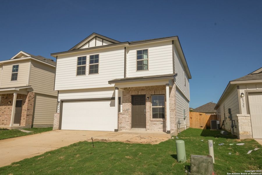 Front exterior of a new home in Winding Brook, San Antonio, TX, highlighting curb appeal (Image 15).