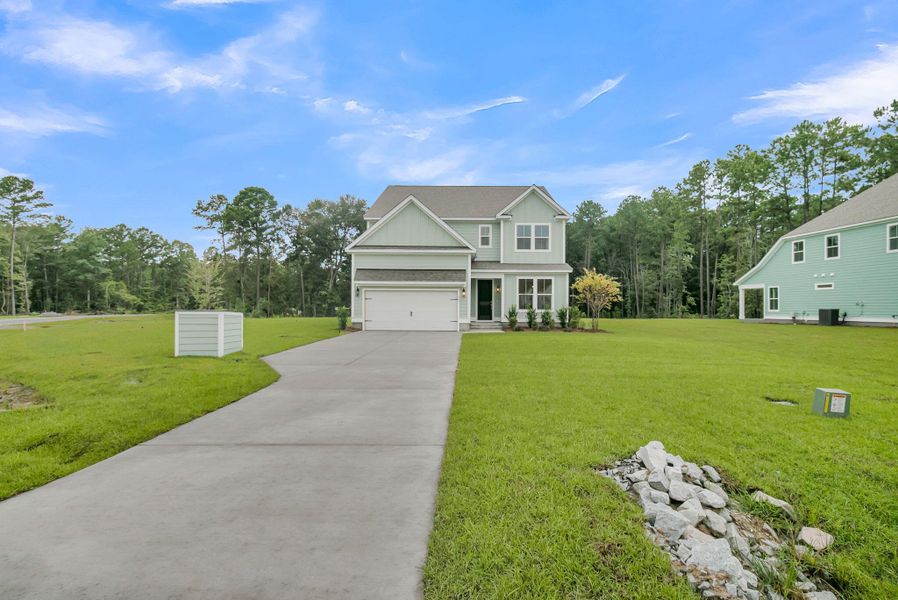 Front exterior of a new home in Cherrywood Estates, Summerville, SC, highlighting curb appeal (Image 25).