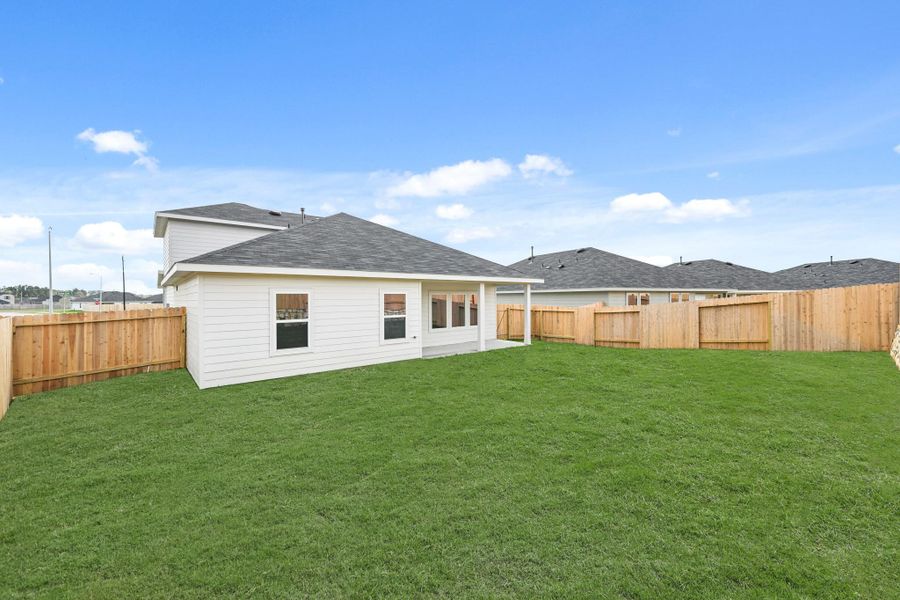Exterior details and patio area of a home in Grand Pines, Magnolia (Image 2).