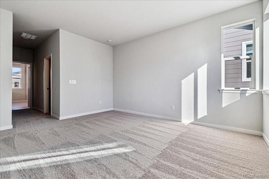 Spacious, unfurnished interior of a new home in Floret Collection at Alder Creek, Parker (Image 8).