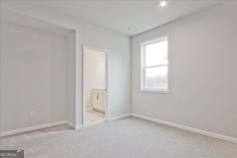 Spacious, unfurnished interior of a new home in The Paddocks at Doc Hughes, Buford (Image 49).