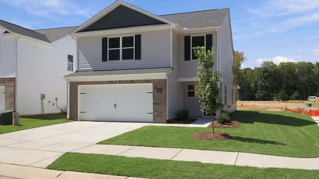 Front exterior of a new home in Carter Ridge, Greenville, NC, highlighting curb appeal (Image 19).