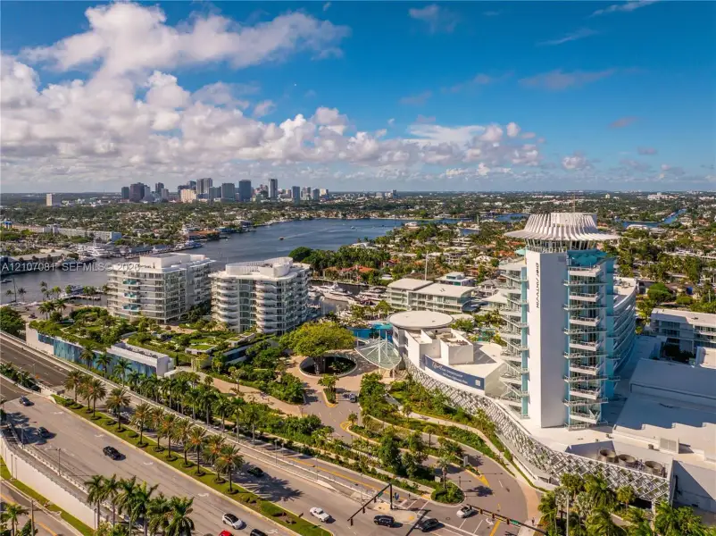 Aerial perspective featuring mid-rise coastal architecture, expansive landscaped grounds, integrated hardscaping, and proximity to the Intracoastal Waterway Aerial perspective featuring mid-rise coastal architecture, expansive landscaped grounds, integrated hardscaping, and proximity to the Intracoastal Waterway