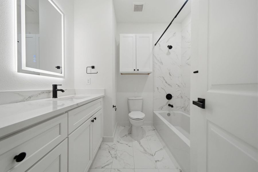 The two guest bedrooms share a hall bathroom. The two guest bedrooms share a hall bathroom.