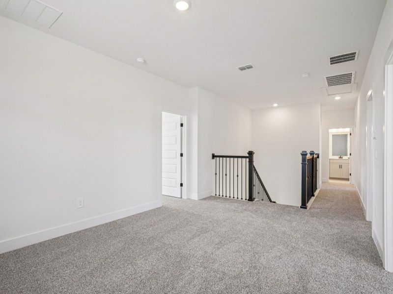 Spacious, unfurnished interior of a new home in Magnolia Bay - Reserve Series, Nokomis (Image 13).