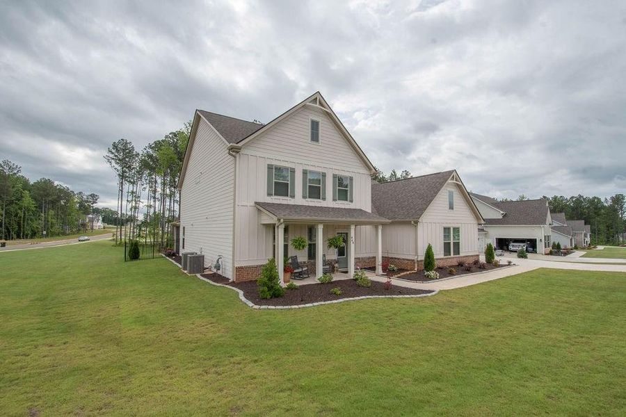 Front exterior of a new home in , Senoia, GA, highlighting curb appeal (Image 20). Front exterior of a new home in , Senoia, GA, highlighting curb appeal (Image 20).