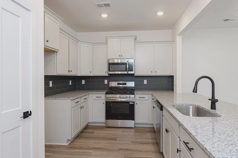 Representative furnished interior of a home built from the 1808 Townhome by Adams Homes in Parkstone Place Townhomes, Roebuck (Image 3). Representative furnished interior of a home built from the 1808 Townhome by Adams Homes in Parkstone Place Townhomes, Roebuck (Image 3).