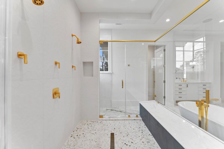 Additional view of the walk in shower, featuring gold hardware throughout Additional view of the walk in shower, featuring gold hardware throughout