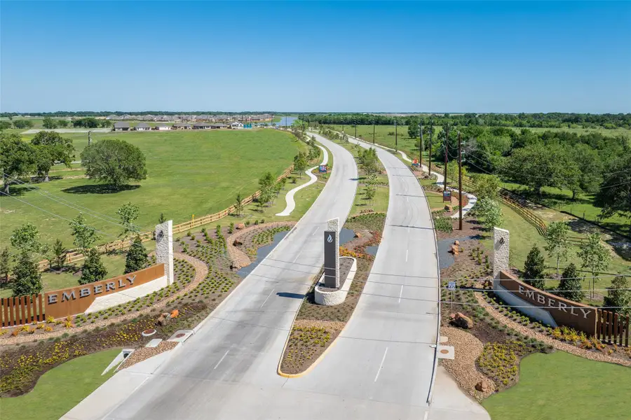 Entrance to the Emberly: Classic Collection community in Beasley, TX, featuring signage and landscaping (Image 1).