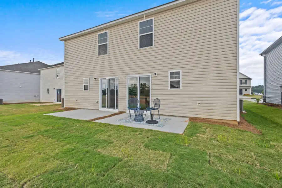 Exterior details and patio area of a home in Champions Village at Cherry Hill, Pendleton (Image 31).