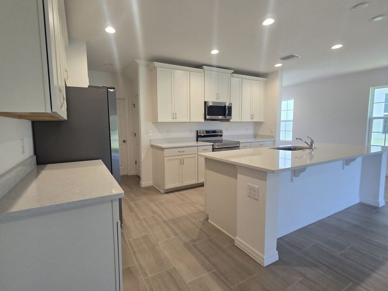 Furnished interior view inside a new home in Sky Lakes Estates, St. Cloud (Image 5).