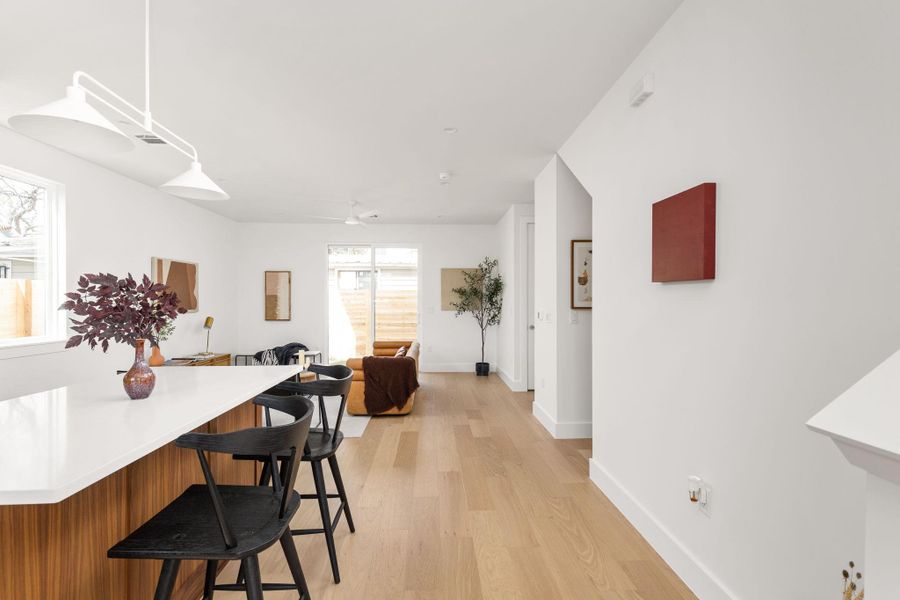 Dining room featuring light wood-style floors and a ceiling fan
