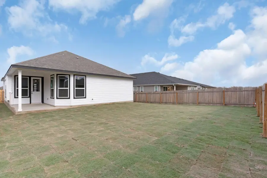 Exterior details and patio area of a home in Carillon, Manor (Image 3).