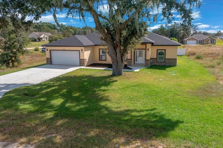 Front exterior of a new home in , Dunnellon, FL, highlighting curb appeal (Image 2). Front exterior of a new home in , Dunnellon, FL, highlighting curb appeal (Image 2).