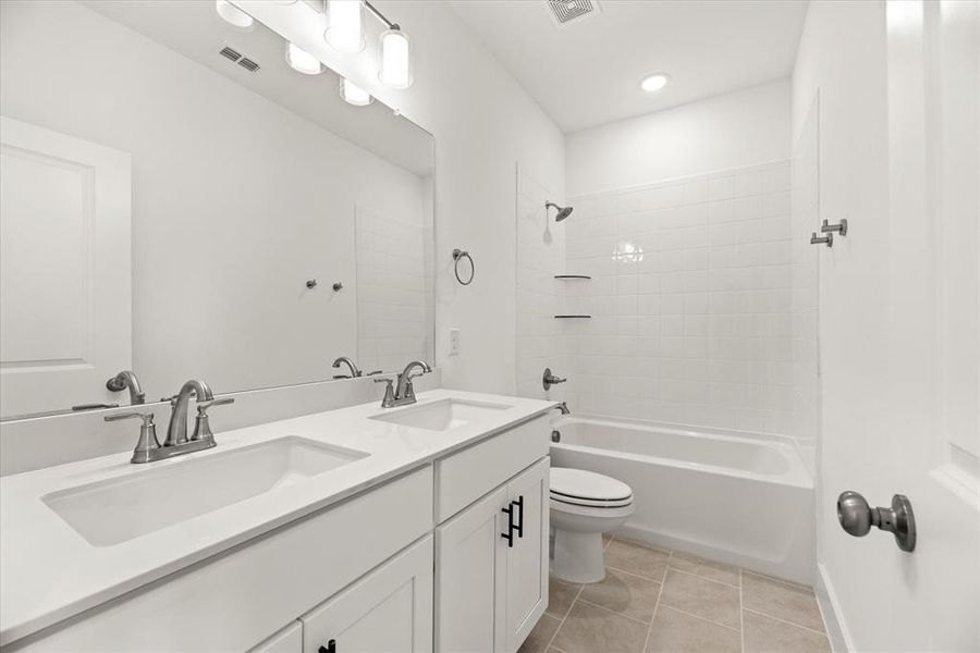 Guests will enjoy their own space in this lovely guest bath!