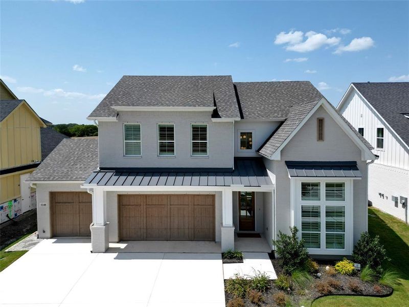 Modern inspired farmhouse with a garage