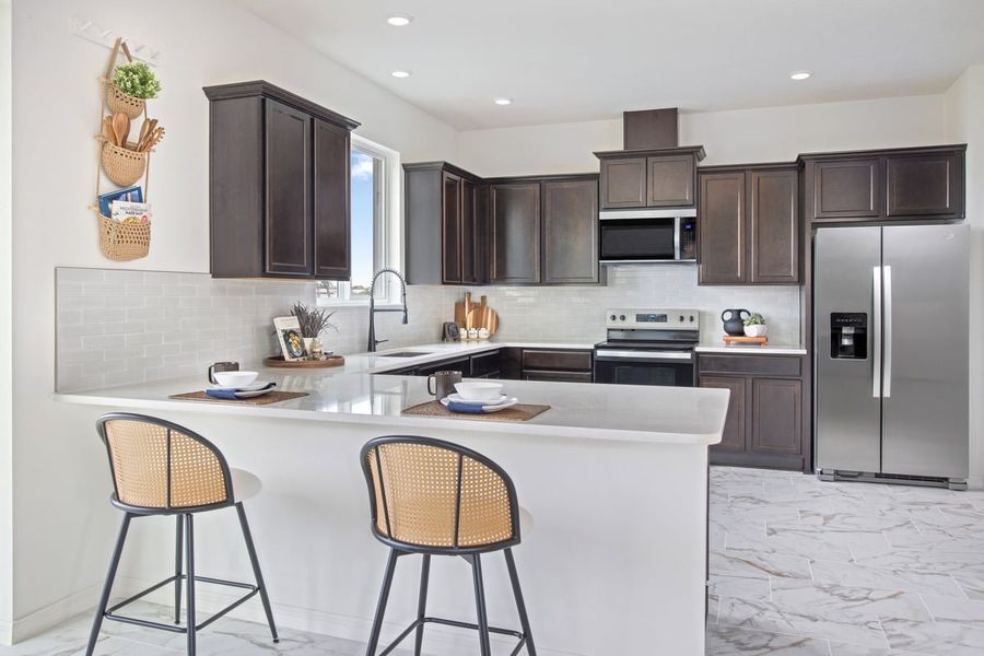 Representative furnished interior of a home built from the Plan 2107 Modeled by KB Home in Heron Glen, Palmetto (Image 6). Representative furnished interior of a home built from the Plan 2107 Modeled by KB Home in Heron Glen, Palmetto (Image 6).