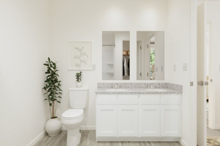 A bathroom with a marble countertop.