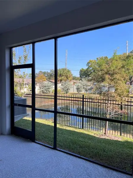 Exterior details and patio area of a home in The Towns At Long Bayou, Seminole (Image 4).