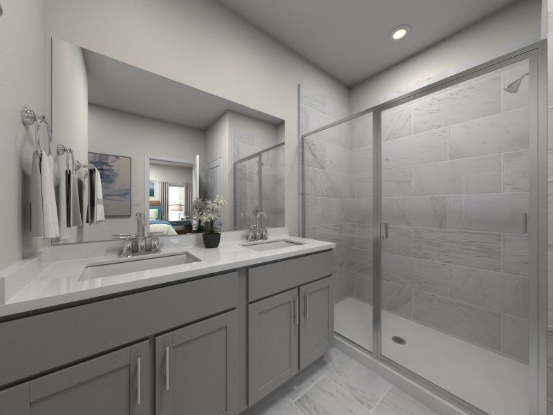 The ensuite bathroom features dual-vanity sinks and a walk-in closet.