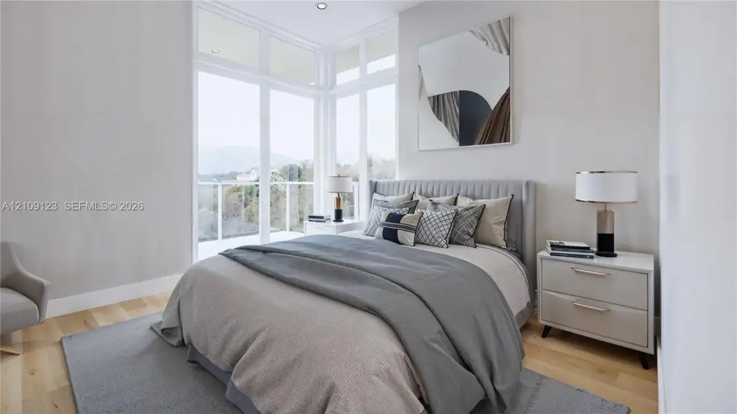 Floor-to-ceiling corner windows, wood-finish flooring, and recessed ceiling lighting Floor-to-ceiling corner windows, wood-finish flooring, and recessed ceiling lighting