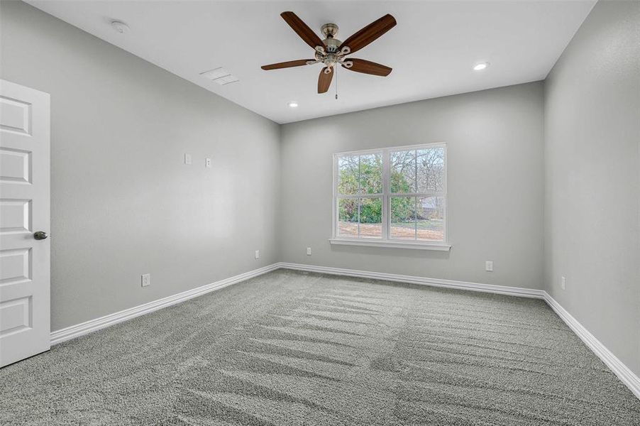 Unfurnished room with carpet flooring and ceiling fan