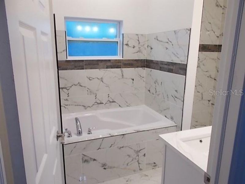 Furnished interior view inside a new home in , Daytona Beach (Image 9).