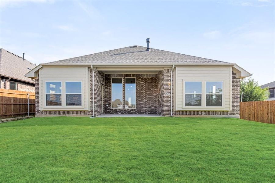Exterior details and patio area of a home in Parks at Panchasarp Farms 55-60, Burleson (Image 2).