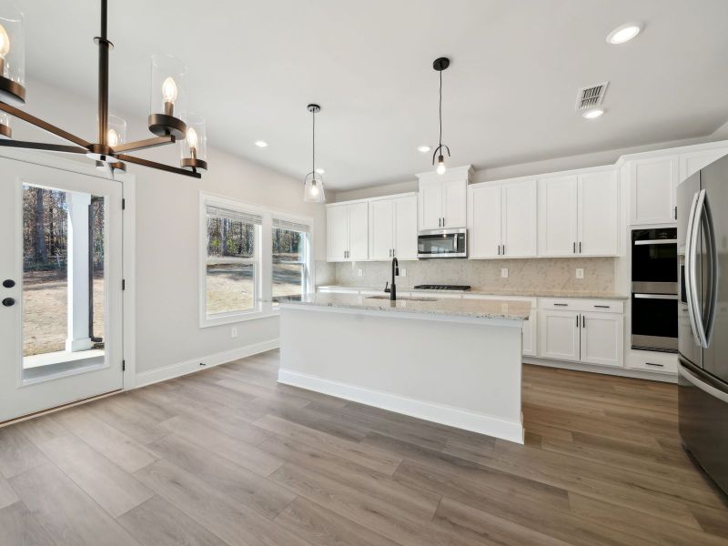 Furnished interior view inside a new home in Martin Springs - Estate Series, Lawrenceville (Image 4).
