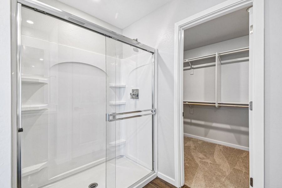 A shower with a glass door. A shower with a glass door.