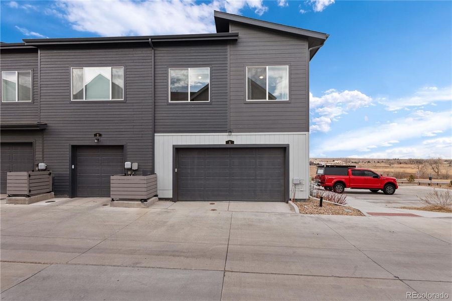 Front exterior of a new home in Whisper Village, Arvada, CO, highlighting curb appeal (Image 26).