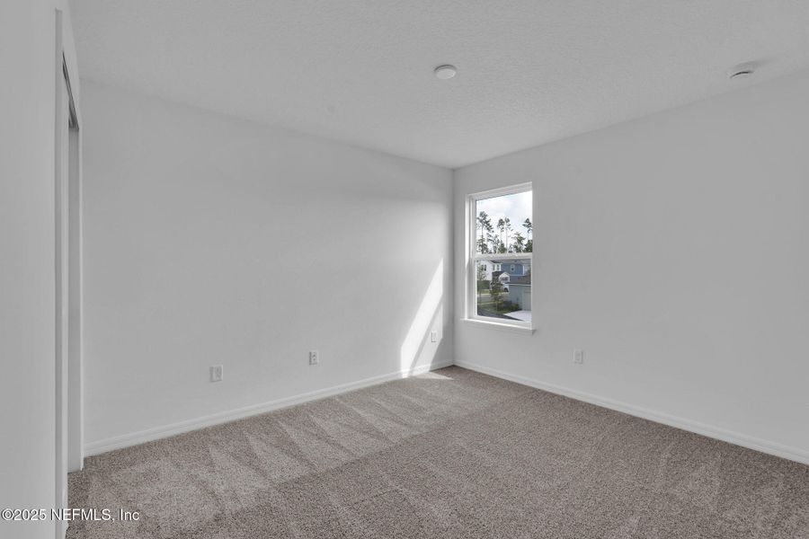Spacious, unfurnished interior of a new home in Hawthorn Park at Wildlight, Yulee (Image 19).