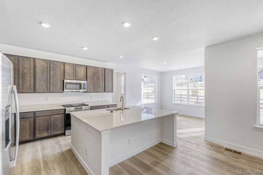Furnished interior view inside a new home in Newlin Crossing, Parker (Image 7).