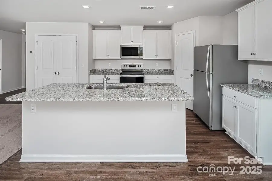 Furnished interior view inside a new home in McKee Creek Village, Charlotte (Image 5).